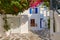 Beautiful traditional streets of Greek island towns. Whitewashed houses, rich bougainvillea in blossom, cobblestone