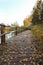 Beautiful trekking path near lovely cal pond in autumn weather