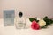 Beautiful and Trendy Perfume Sprayer on a White Table with Two Roses