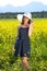 Beautiful trendy woman in a summer sunhat.