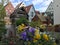 A beautiful of triangle roof village in FÃ¼ssen city with blurred flowers in front.