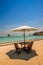 Beautiful tropical beach in kuta Lombok with wooden chair and sunbeds/ umbrella