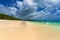 Beautiful tropical beach with picturesque cloudscape