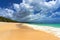 Beautiful tropical beach with picturesque cloudscape