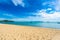 Beautiful tropical beach sea and ocean with coconut palm tree  and umbrella and chair on blue sky and white cloud