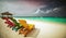 Beautiful tropical beach with white sand, colorful sun loungers and umbrellas. AI generated illustration