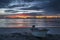 A beautiful tropical dawn with a boat on beach