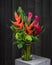 Beautiful Tropical Flower Bouquet in a Vase Wood Background - Modern Flower Arrangement by Florist - Heliconia - Red Ginger