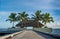 Beautiful tropical landscape with wooden hut on bridge with palm trees near the ocean at Maldives