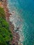 Beautiful tropical sea shore top view.  Rocky coast and turquoise sea. Travel and relaxation concept