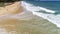 Beautiful tropical sea and wave crashing on sandy shore at karon beach in phuket thailand,aerial view drone shot