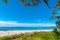 Beautiful tropical white sand beach in blue lagoon and blue sky space. Australia, Hyams Beach, NSW