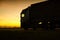 A beautiful truck with a trailer against the backdrop of an evening sunset before night. The concept of work and rest regime for