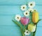 Beautiful tulips of chrysanthemum mothers day , on a blue wooden background