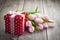 Beautiful tulips with red polka-dot gift box