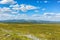 Beautiful tundra landscape view with mountains in the horizon at summer