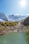 Beautiful turquoise lake in Dombay mountains, trekking in national park to the Alibek waterfall and glacier