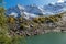 Beautiful turquoise lake in Dombay mountains, trekking in national park to the Alibek waterfall and glacier