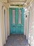 Beautiful turquoise wooden door in the old building, Cape Town
