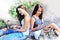 Beautiful two girl teen working and online shopping on smart phone device in the park.