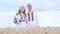 A beautiful Ukrainian couple in embroidered dresses in the middle of a field, traditions, patriotism