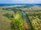 Beautiful Ukrainian nature background. Drone view on riverbank of the Seym river and amazing cloudscape over it. Summertime