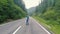 Beautiful Ukrainian young man traveler walks along the beautiful mountains in Romania. Transalpina mountain road