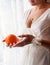 Beautiful unrecognizable bride with an orange