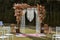 Beautiful unusual boho chic wedding arch for outside ceremony