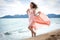 Beautiful unusual woman walking on the beach