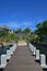 Beautiful upscale resort hotel with small wooden bridge connecting the walkway with the villas