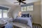 Beautiful upstairs spare bedroom with neutral colors and windows