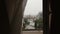 Beautiful urban Paris landscape from the open window. Rainy day