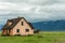 Beautiful valley with old house in mountains. Springtime on mountain hills.