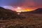 Beautiful valley with water reservoir in Mourne Mountains at golden hour and dramatic sunset