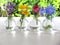 Beautiful of various flowers and variety of colors in the vases set