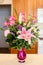 Beautiful vase of pink flowers including roses, carnations, and lillies