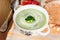 Beautiful vegetarian brocoli soup in a white bowl.