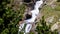 Beautiful veil cascading waterfall, mossy rocks in Valley Nuria in Catalonia of Spain