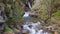 Beautiful veil cascading waterfall, mossy rocks in Valley Nuria in Catalonia of Spain