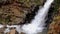 Beautiful veil cascading waterfall, mossy rocks in Valley Nuria in Catalonia of Spain