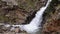 Beautiful veil cascading waterfall, mossy rocks in Valley Nuria in Catalonia of Spain