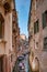 Beautiful venetian street in summer day, Italy - Gondola riders