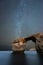 A beautiful vertical Milky Way night sky landscape photograph of the famous Azure Window rock arch