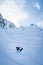 Beautiful vertical picture of a sportsman carving on a snowboard on the snowy slope