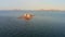 Beautiful vertical rocks sticking out of the water at dawn. Sea stack