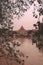 Beautiful vertical shot of a grey concrete dome near the water in Rome, Italy