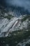 Beautiful vertical view of waterfall on zugspitze, the biggest mountain in germany