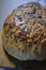 Beautiful very hearty bread homemade recipe. Brown bread with crispy crust, black caraway seeds and brown flax kernels.