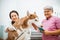 a beautiful veteranian checking the dog with stethoscope